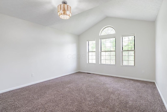 6377 Dietz Dr, Canal Winchester, OH 43110 - spare room with carpet flooring, lofted ceiling, and baseboards