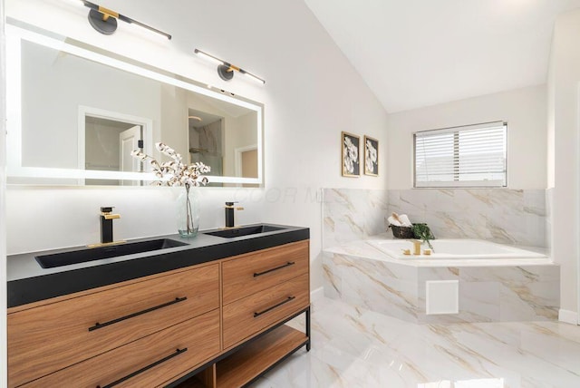 6377 Dietz Dr, Canal Winchester, OH 43110 - full bath featuring a garden tub, double vanity, lofted ceiling, and marble tiled floors
