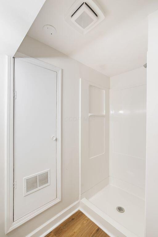 6377 Dietz Dr, Canal Winchester, OH 43110 - full bath with wood finished floors, baseboards, and a shower