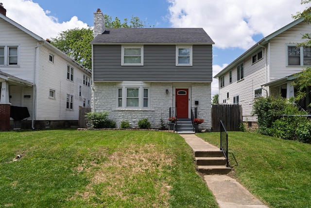 41 N Westmoor Ave, Columbus, OH 43204 - colonial-style house featuring stone siding and a chimney