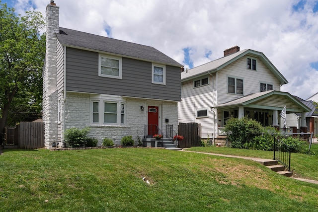 41 N Westmoor Ave, Columbus, OH 43204 - colonial house with stone siding and a chimney