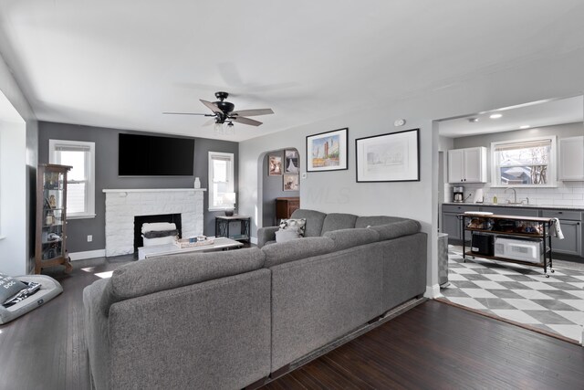 41 N Westmoor Ave, Columbus, OH 43204 - living room with ceiling fan, a stone fireplace, plenty of natural light, and baseboards