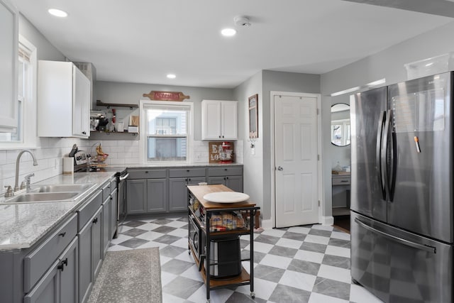 41 N Westmoor Ave, Columbus, OH 43204 - kitchen with stainless steel appliances, gray cabinets, a sink, light flooring, and light countertops