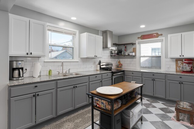 41 N Westmoor Ave, Columbus, OH 43204 - kitchen with a sink, stainless steel electric range oven, gray cabinetry, backsplash, and recessed lighting