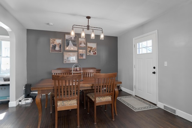 41 N Westmoor Ave, Columbus, OH 43204 - dining area with arched walkways, wood finished floors, and baseboards