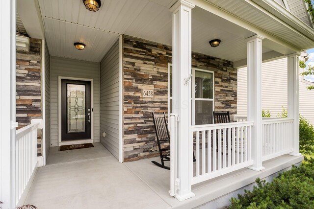 6458 Tallman Ct, Canal Winchester, OH 43110 - entrance to property featuring stone siding and a porch