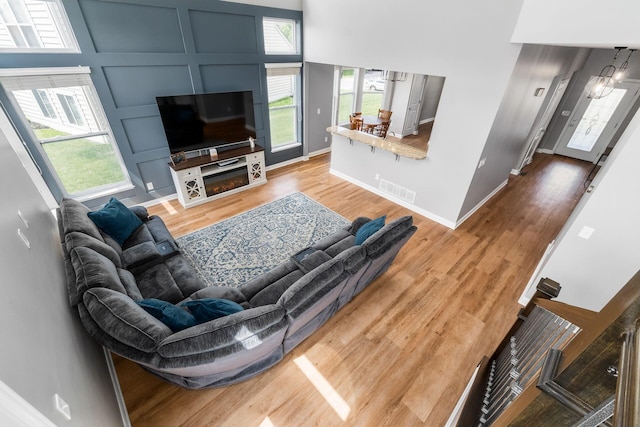 6458 Tallman Ct, Canal Winchester, OH 43110 - living area featuring wood finished floors, baseboards, and a decorative wall