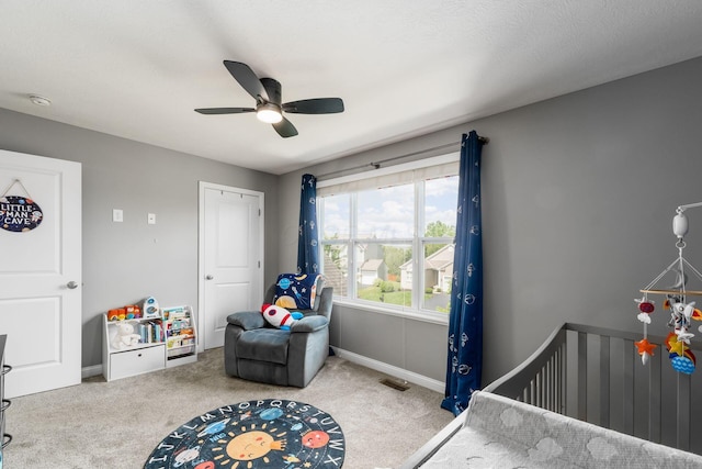6458 Tallman Ct, Canal Winchester, OH 43110 - carpeted bedroom featuring a crib, ceiling fan, and baseboards