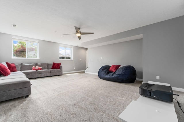6458 Tallman Ct, Canal Winchester, OH 43110 - living area featuring carpet, a ceiling fan, and baseboards