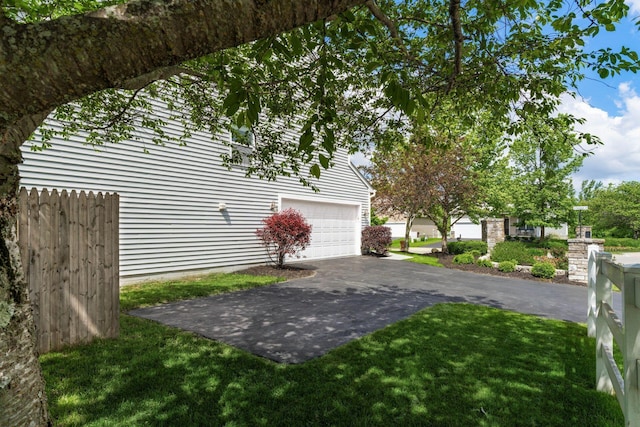 6458 Tallman Ct, Canal Winchester, OH 43110 - view of home's exterior with a garage and asphalt driveway