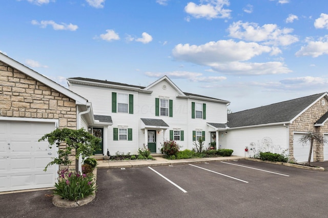 1994 Hoadley Dr Unit 7C, Columbus, OH 43228 - view of property with stone siding and uncovered parking