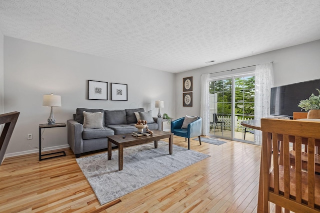 1994 Hoadley Dr Unit 7C, Columbus, OH 43228 - living area with light wood-type flooring and a textured ceiling