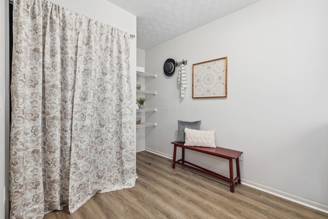 1994 Hoadley Dr Unit 7C, Columbus, OH 43228 - stairway with wood finished floors, baseboards, and a textured ceiling