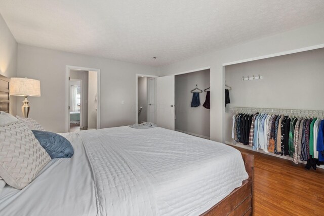 1994 Hoadley Dr Unit 7C, Columbus, OH 43228 - bedroom featuring multiple closets and wood finished floors