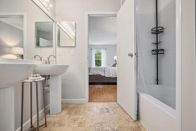 1994 Hoadley Dr Unit 7C, Columbus, OH 43228 - ensuite bathroom featuring tub / shower combination and baseboards