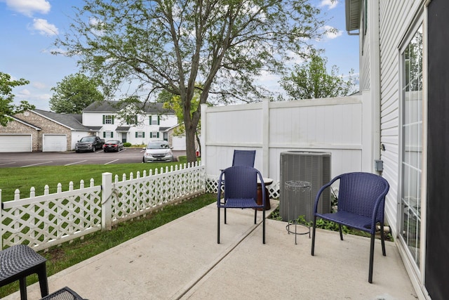 1994 Hoadley Dr Unit 7C, Columbus, OH 43228 - view of patio featuring central AC and a residential view