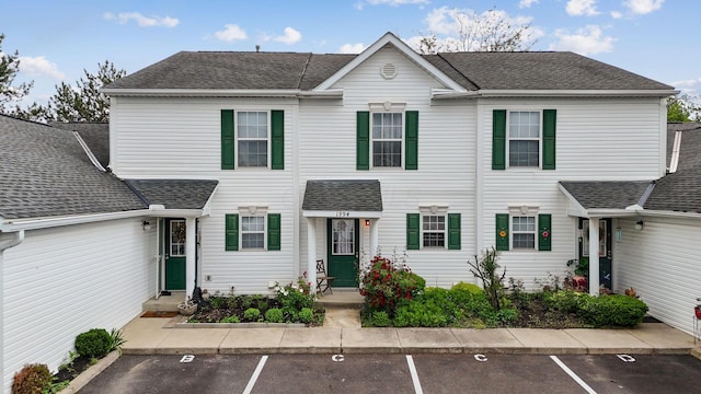 1994 Hoadley Dr Unit 7C, Columbus, OH 43228 - view of front facade featuring uncovered parking and roof with shingles