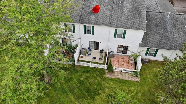 1994 Hoadley Dr Unit 7C, Columbus, OH 43228 - rear view of property with a shingled roof, a patio, a yard, central AC, and outdoor lounge area