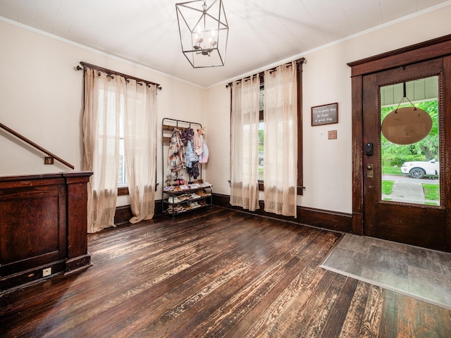 154 Montgomery Blvd, New Concord, OH 43762 - foyer entrance with dark wood-style flooring, a chandelier, crown molding, and baseboards