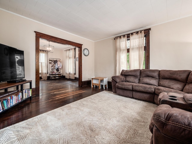 154 Montgomery Blvd, New Concord, OH 43762 - living room with crown molding, wood finished floors, and a chandelier