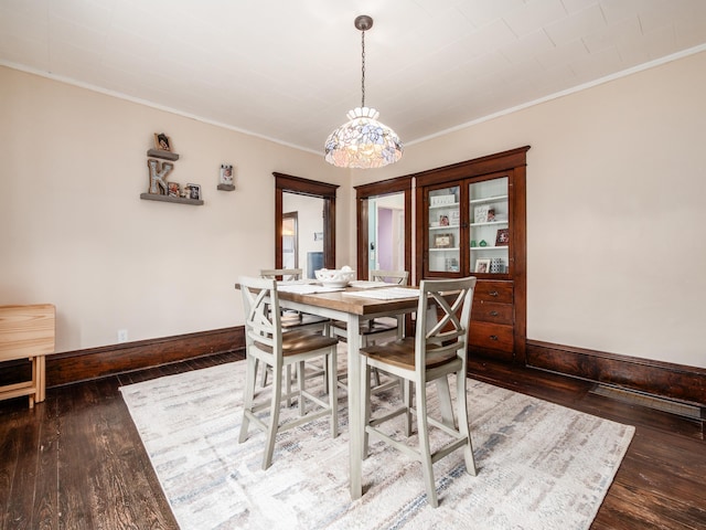 154 Montgomery Blvd, New Concord, OH 43762 - dining room with baseboards, ornamental molding, wood finished floors, and a chandelier