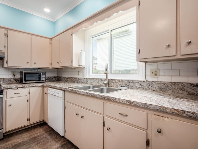 154 Montgomery Blvd, New Concord, OH 43762 - kitchen featuring white dishwasher, stainless steel microwave, a sink, crown molding, and backsplash