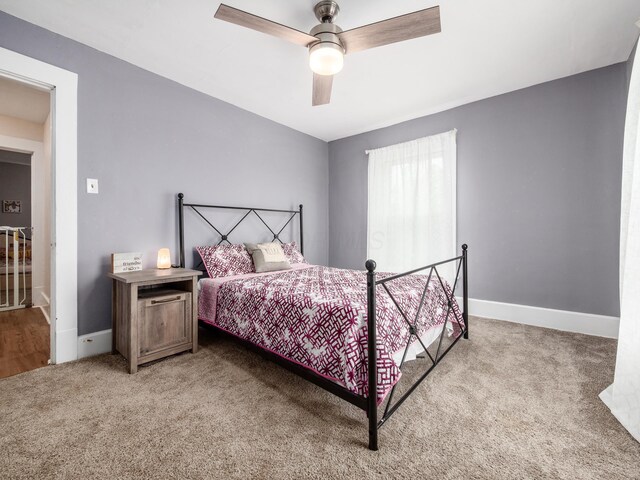 154 Montgomery Blvd, New Concord, OH 43762 - carpeted bedroom featuring baseboards and a ceiling fan