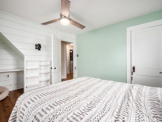 154 Montgomery Blvd, New Concord, OH 43762 - bedroom featuring dark wood finished floors, a closet, and ceiling fan