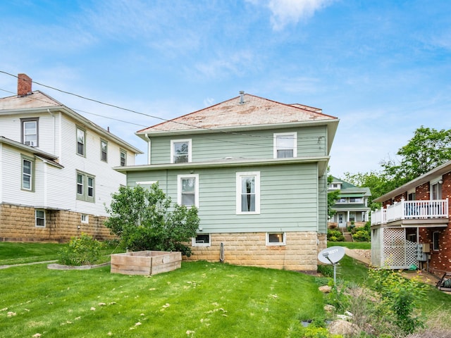 154 Montgomery Blvd, New Concord, OH 43762 - back of property with a lawn and a wooden deck