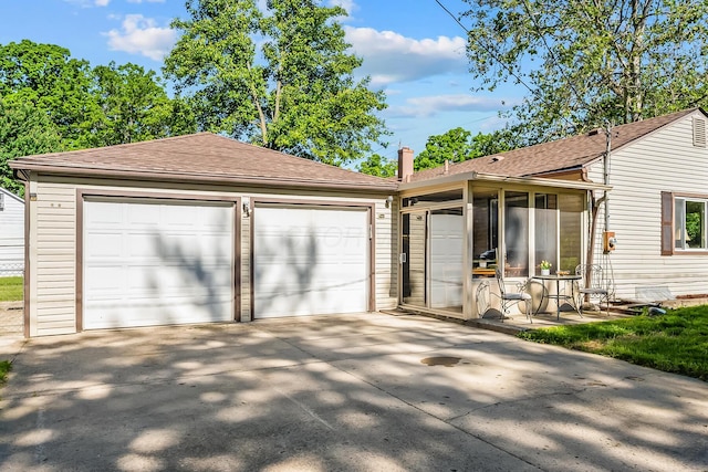 225 W Heffner St, Delaware, OH 43015 - view of front of home with a shingled roof, concrete driveway, and an attached garage