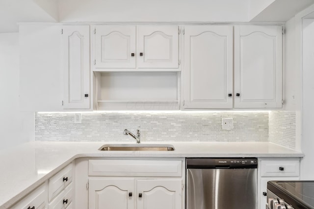 225 W Heffner St, Delaware, OH 43015 - kitchen featuring stainless steel dishwasher, a sink, and white cabinetry
