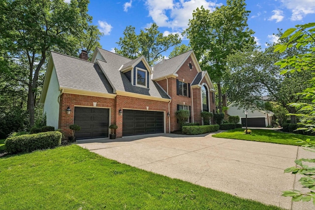 1229 Whispering Meadow Ct, New Albany, OH 43054 - view of front of property with brick siding, a front yard, concrete driveway, a shingled roof, and a chimney