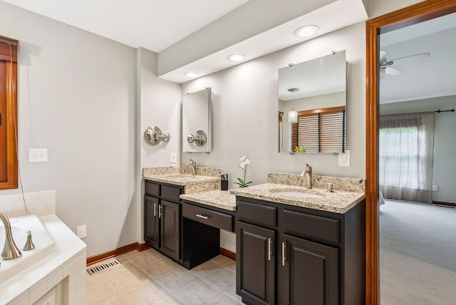 1229 Whispering Meadow Ct, New Albany, OH 43054 - full bath featuring double vanity, a ceiling fan, tiled tub, recessed lighting, and tile patterned flooring