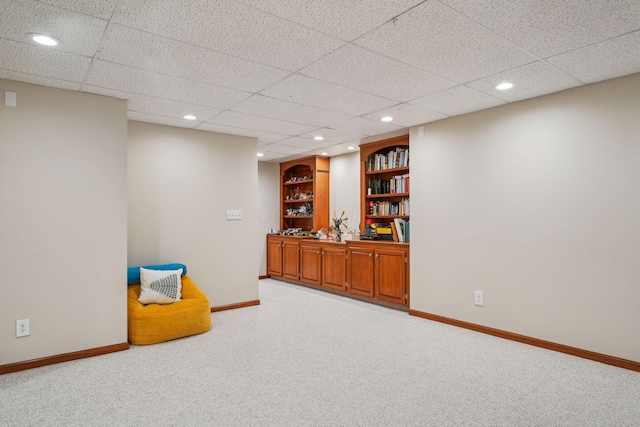 1229 Whispering Meadow Ct, New Albany, OH 43054 - sitting room featuring light colored carpet, recessed lighting, a paneled ceiling, and built in features