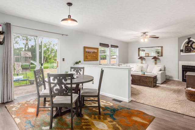 2535 Linbaugh Rd, Grove City, OH 43123 - dining space featuring ceiling fan, wood finished floors, and a textured ceiling