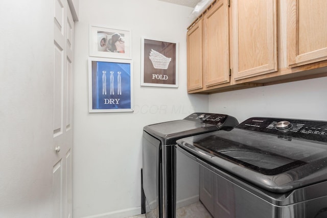 2535 Linbaugh Rd, Grove City, OH 43123 - washroom featuring washer and clothes dryer, cabinet space, and baseboards