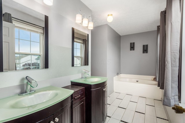 2535 Linbaugh Rd, Grove City, OH 43123 - bathroom with a tub, two vanities, and tile patterned floors