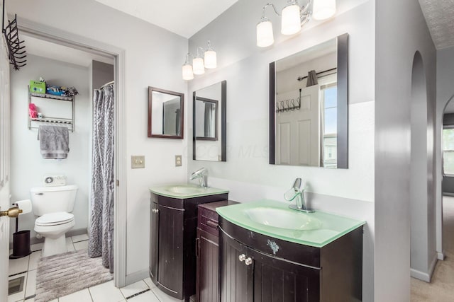 2535 Linbaugh Rd, Grove City, OH 43123 - bathroom with two vanities, toilet, and baseboards