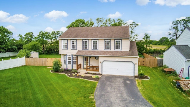 2535 Linbaugh Rd, Grove City, OH 43123 - view of front of property with driveway, a garage, covered porch, and roof with shingles