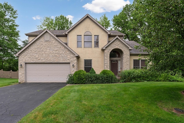 7415 Sand Spurrey Ct, Westerville, OH 43082 - traditional-style home featuring stucco siding, stone siding, driveway, a garage, and a shingled roof