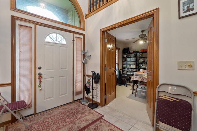 7415 Sand Spurrey Ct, Westerville, OH 43082 - foyer entrance featuring light tile patterned floors, a ceiling fan, and light colored carpet