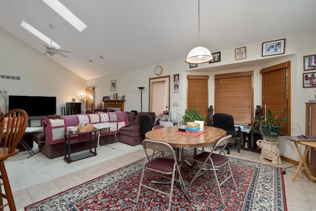 7415 Sand Spurrey Ct, Westerville, OH 43082 - dining space with a skylight, light tile patterned floors, ceiling fan, and high vaulted ceiling