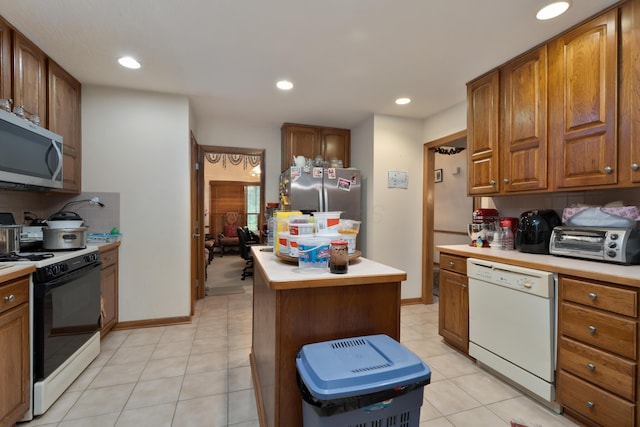 7415 Sand Spurrey Ct, Westerville, OH 43082 - kitchen with appliances with stainless steel finishes, light countertops, decorative backsplash, and recessed lighting