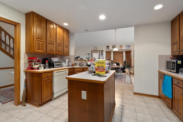 7415 Sand Spurrey Ct, Westerville, OH 43082 - kitchen with white dishwasher, light countertops, brown cabinets, and recessed lighting