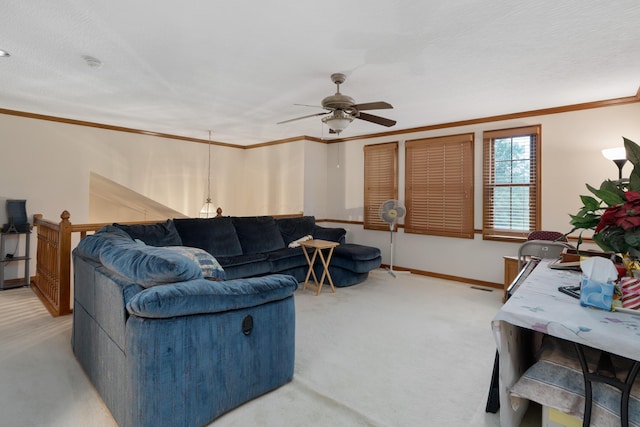 7415 Sand Spurrey Ct, Westerville, OH 43082 - living area featuring ornamental molding, light colored carpet, a ceiling fan, and baseboards