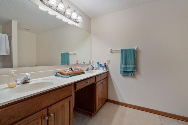 7415 Sand Spurrey Ct, Westerville, OH 43082 - full bathroom featuring double vanity, tile patterned flooring, and baseboards