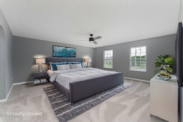 5924 Morrissey St Unit 5924E, Columbus, OH 43232 - bedroom with light carpet, a textured ceiling, baseboards, and a ceiling fan