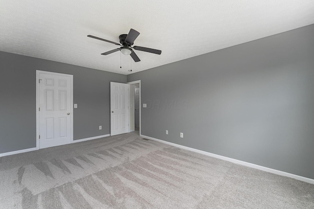 5924 Morrissey St Unit 5924E, Columbus, OH 43232 - unfurnished bedroom featuring light carpet, baseboards, and ceiling fan