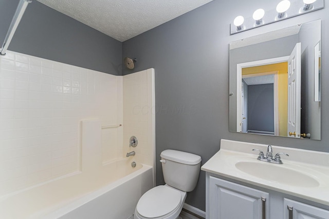 5924 Morrissey St Unit 5924E, Columbus, OH 43232 - bathroom featuring toilet, vanity, shower / bath combination, and a textured ceiling