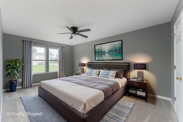 5924 Morrissey St Unit 5924E, Columbus, OH 43232 - bedroom with light carpet, baseboards, and ceiling fan